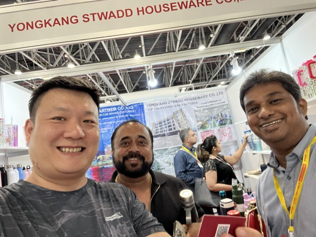 STWADD staff with a buyer at a Dubai exhibition