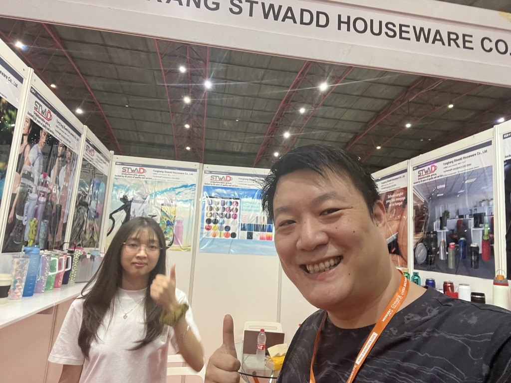 STWADD booth banner at HOMELIFE Indonesia with a buyer at the stand